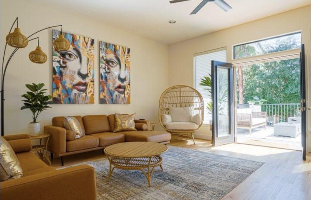Bright living room opening to a balcony in Houston