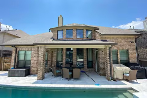 Covered patio overlooking the pool in Pearland