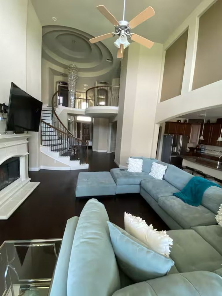 Open-concept living room with high ceilings in Pearland