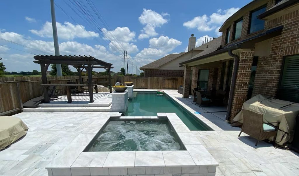Backyard pool and hot tub at the Pearland home